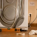 Lave linge branchement : tuyau évacuation à 65-100 cm sans fuite